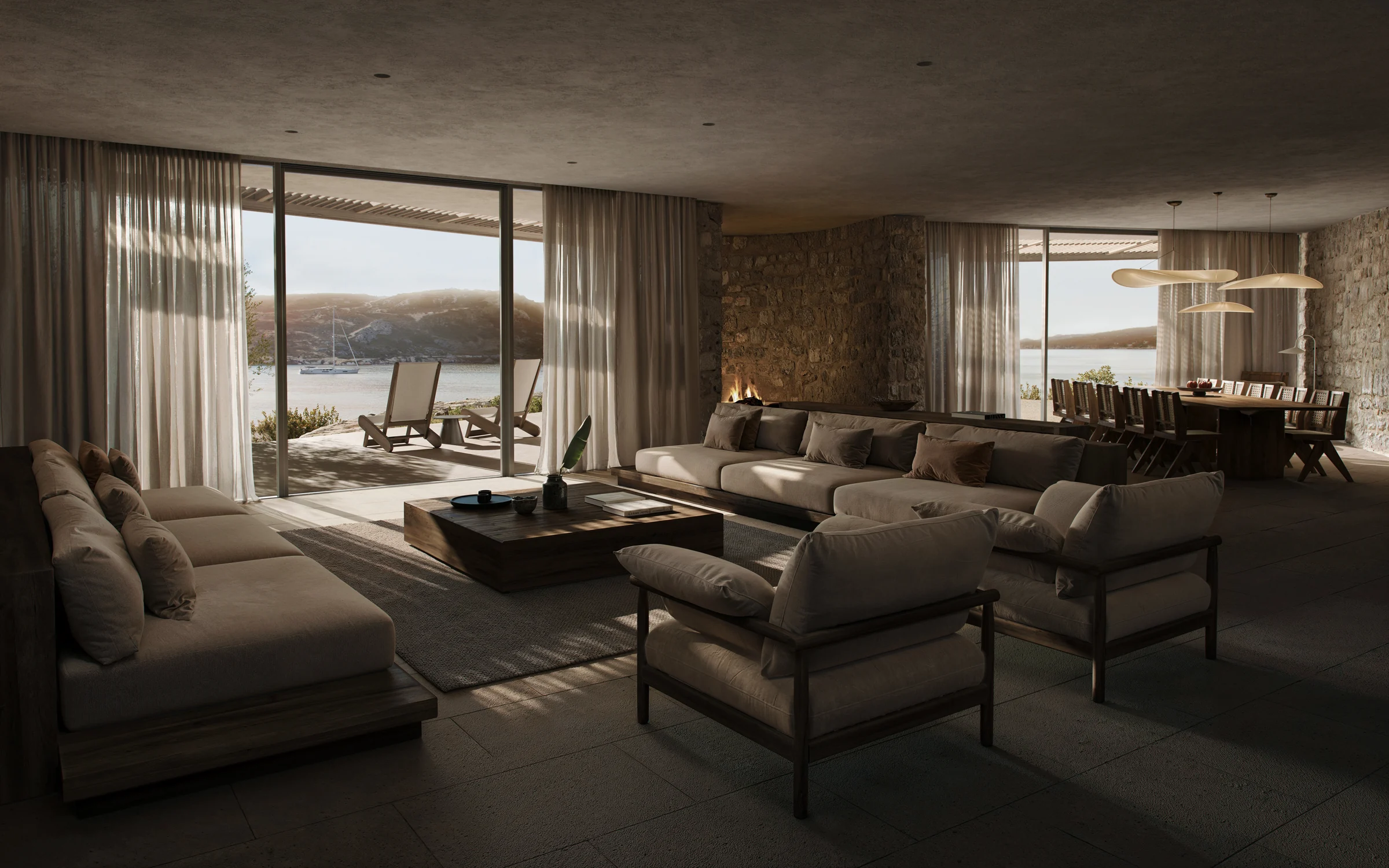 Maison Cheval living space with stone walls and coastal glazing